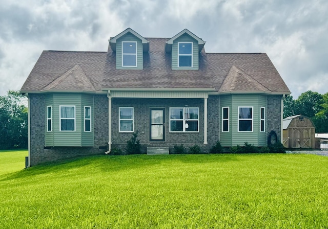 8024 Hoskins Hollow Rd, Westmoreland, TN 37186 - view of front of house with a front lawn, a shingled roof, and a shed