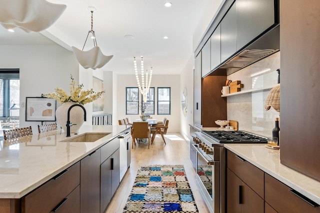 1209 Noelton Ave, Nashville, TN 37215 - kitchen with stainless steel appliances, light wood-style flooring, recessed lighting, light stone countertops, and pendant lighting