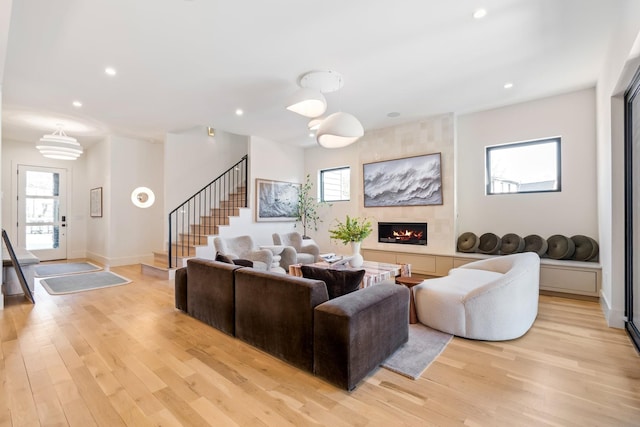1209 Noelton Ave, Nashville, TN 37215 - living area with stairway, light wood-style flooring, plenty of natural light, a tile fireplace, and recessed lighting
