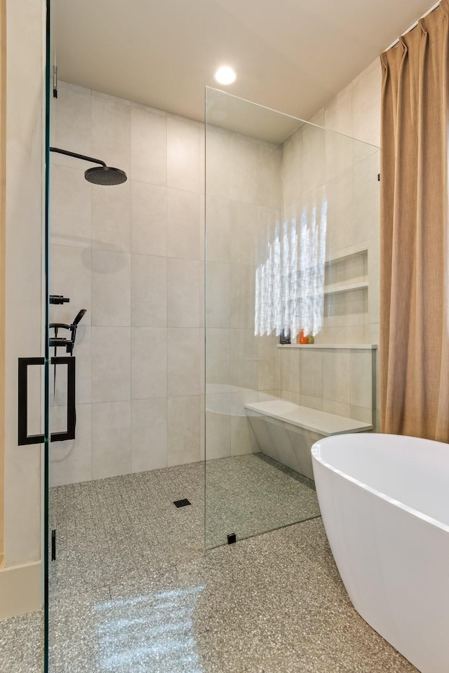 1209 Noelton Ave, Nashville, TN 37215 - bathroom featuring tiled shower, a freestanding bath, and recessed lighting