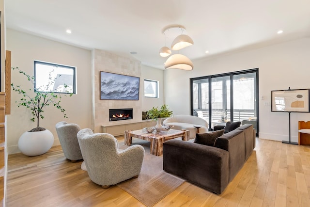 1209 Noelton Ave, Nashville, TN 37215 - living room featuring a tile fireplace, light wood-style flooring, and recessed lighting