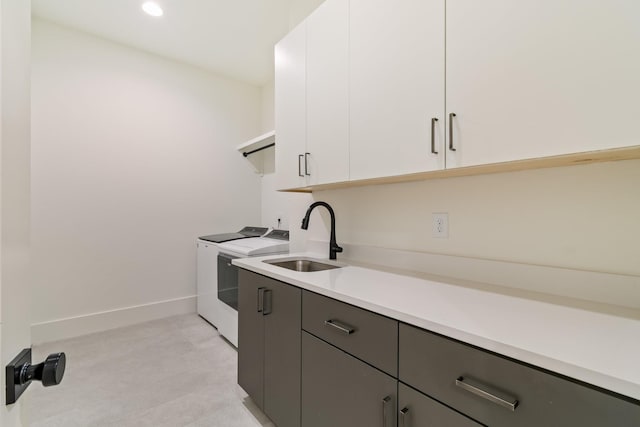 1209 Noelton Ave, Nashville, TN 37215 - laundry area featuring cabinet space, washer and clothes dryer, and recessed lighting