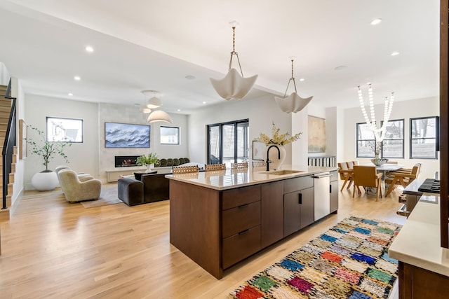 1209 Noelton Ave, Nashville, TN 37215 - kitchen featuring dishwasher, an island with sink, open floor plan, light countertops, and healthy amount of natural light