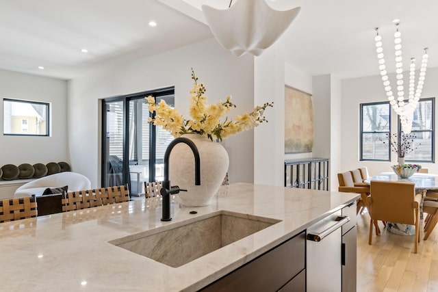 1209 Noelton Ave, Nashville, TN 37215 - kitchen with light wood-type flooring, light stone countertops, recessed lighting, modern cabinets, and open floor plan