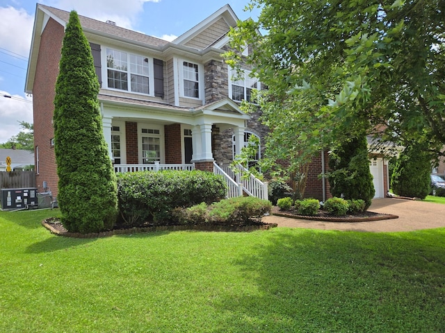 821 Alex Way, Mount Juliet, TN 37122 - craftsman house featuring covered porch, concrete driveway, brick siding, stone siding, and a garage