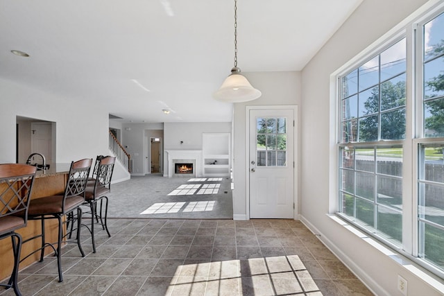 821 Alex Way, Mount Juliet, TN 37122 - dining space featuring plenty of natural light, a warm lit fireplace, and stairway