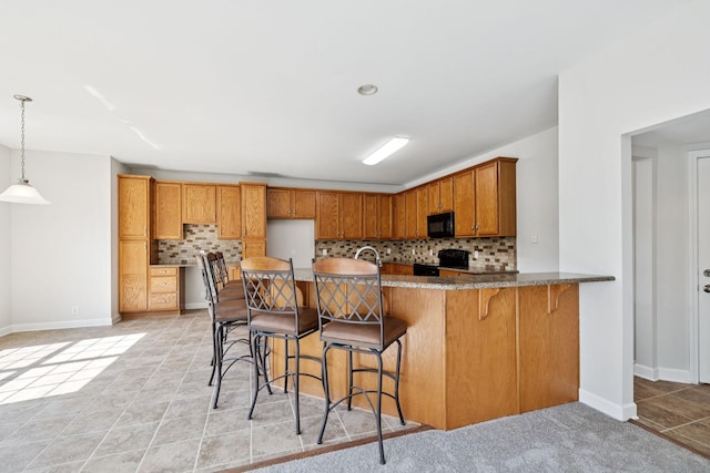 821 Alex Way, Mount Juliet, TN 37122 - kitchen with black microwave, backsplash, range with electric cooktop, and a peninsula