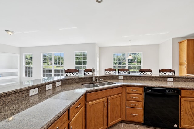 821 Alex Way, Mount Juliet, TN 37122 - kitchen with black dishwasher, dark stone counters, brown cabinets, and plenty of natural light