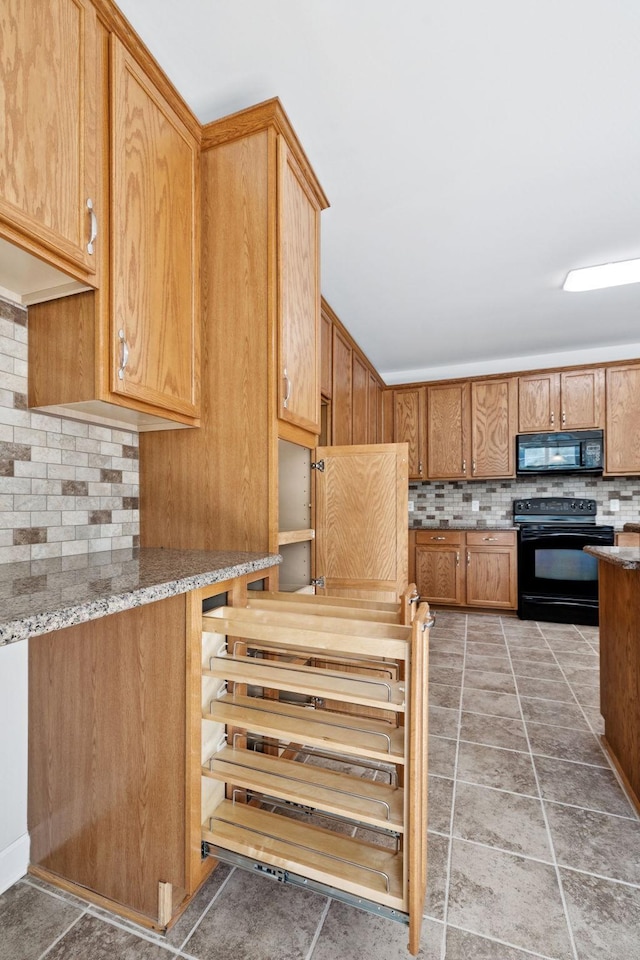821 Alex Way, Mount Juliet, TN 37122 - kitchen featuring black appliances, tasteful backsplash, light stone counters, and light tile patterned flooring