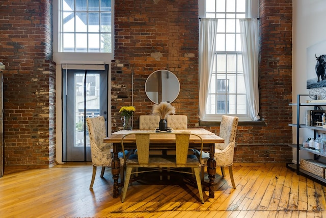 1350 Rosa L Parks Blvd Unit 365, Nashville, TN 37208 - dining area featuring light wood finished floors and brick wall