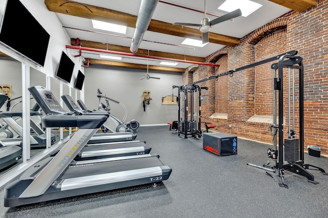 1350 Rosa L Parks Blvd Unit 365, Nashville, TN 37208 - workout area with ceiling fan, brick wall, a skylight, and beamed ceiling