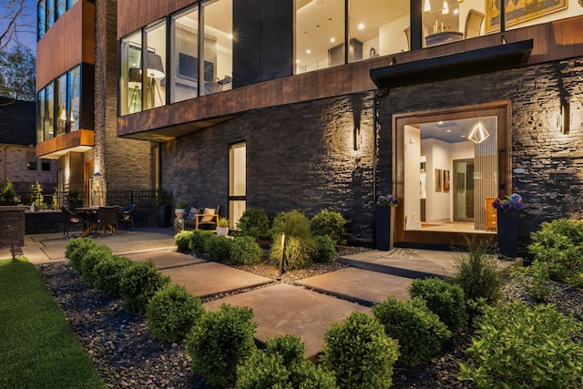 108 46th Ave N, Nashville, TN 37209 - view of exterior entry with stone siding and a patio area