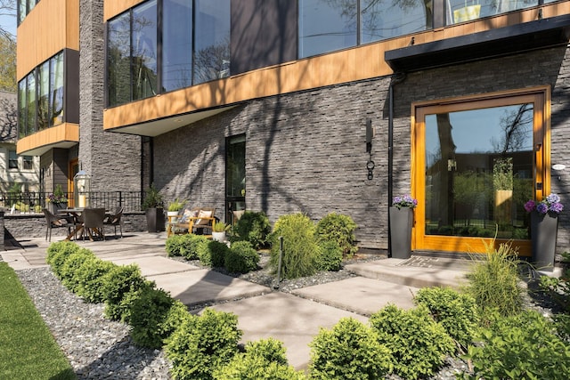 108 46th Ave N, Nashville, TN 37209 - property entrance with stone siding and a patio area