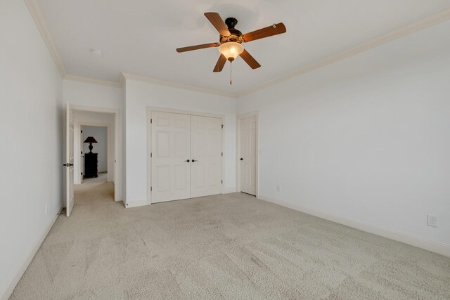438 Truman Rd, Franklin, TN 37064 - unfurnished bedroom with ornamental molding, light colored carpet, ceiling fan, and a closet