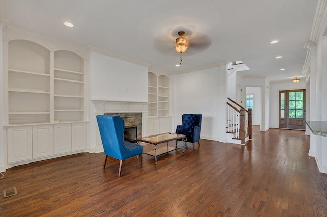 438 Truman Rd, Franklin, TN 37064 - unfurnished room with ornamental molding, stairs, built in features, wood finished floors, and a fireplace with raised hearth