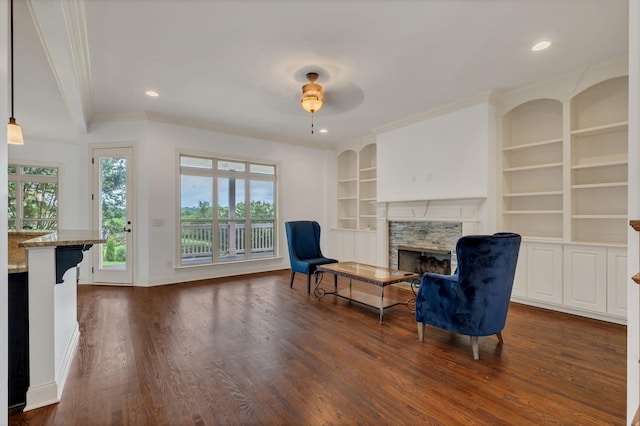 438 Truman Rd, Franklin, TN 37064 - sitting room with a premium fireplace, dark wood-style flooring, built in shelves, ornamental molding, and recessed lighting