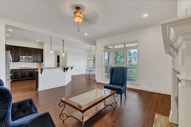 438 Truman Rd, Franklin, TN 37064 - living room featuring dark wood-style flooring, a ceiling fan, recessed lighting, and crown molding