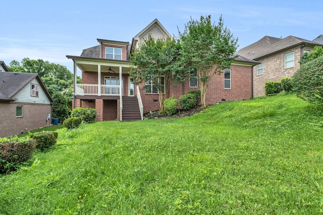 438 Truman Rd, Franklin, TN 37064 - rear view of property with ceiling fan, stairway, a lawn, and brick siding