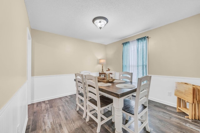110 Sandis Ln, Palmyra, TN 37142 - dining area featuring wood finished floors, wainscoting, and a textured ceiling
