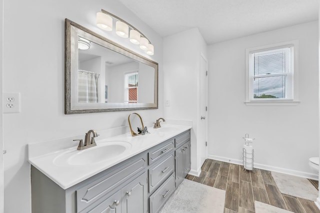 110 Sandis Ln, Palmyra, TN 37142 - full bathroom with double vanity and wood finished floors