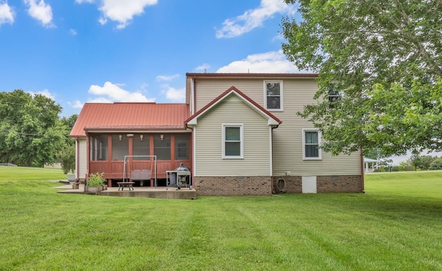 110 Sandis Ln, Palmyra, TN 37142 - back of house featuring a yard, a patio area, a sunroom, crawl space, and a metal roof