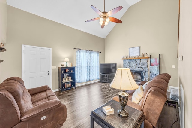 110 Sandis Ln, Palmyra, TN 37142 - living room featuring high vaulted ceiling, ceiling fan, wood finished floors, and a stone fireplace