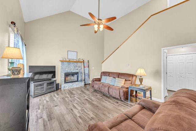 110 Sandis Ln, Palmyra, TN 37142 - living room featuring high vaulted ceiling, a ceiling fan, wood finished floors, and a fireplace