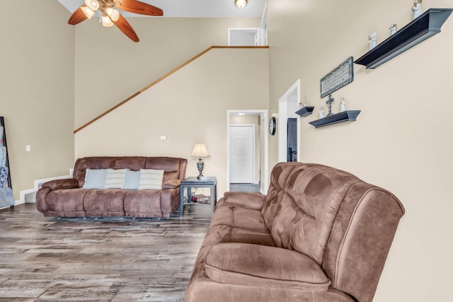 110 Sandis Ln, Palmyra, TN 37142 - living area featuring wood finished floors, ceiling fan, and high vaulted ceiling