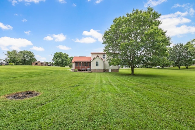 110 Sandis Ln, Palmyra, TN 37142 - view of grassy yard with a wooden deck