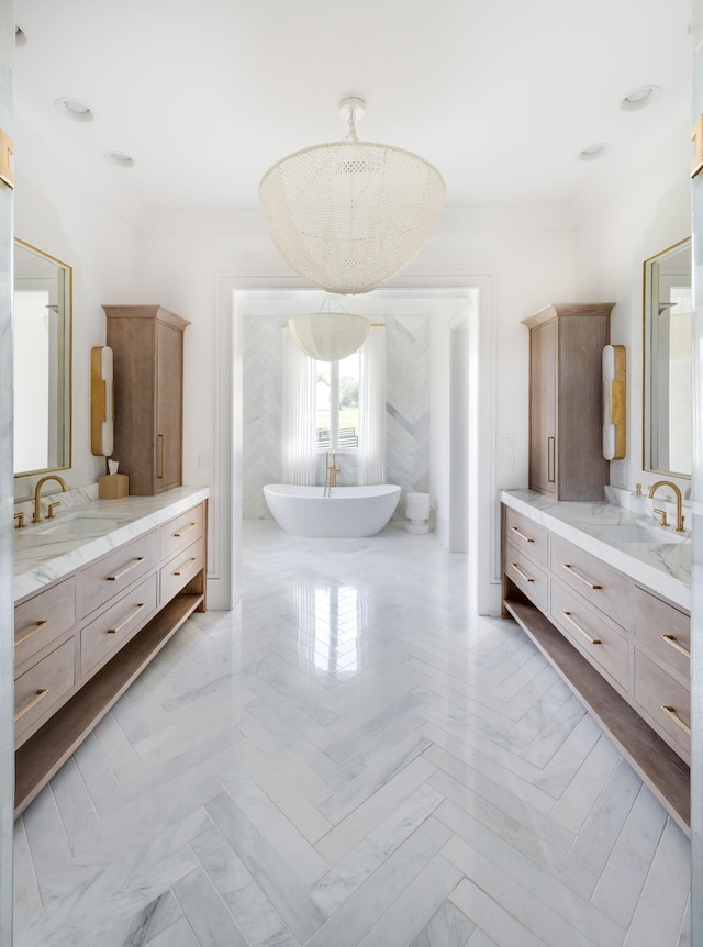 1713 Reflection Ln, Brentwood, TN 37027 - full bath featuring two vanities, a soaking tub, and ornamental molding