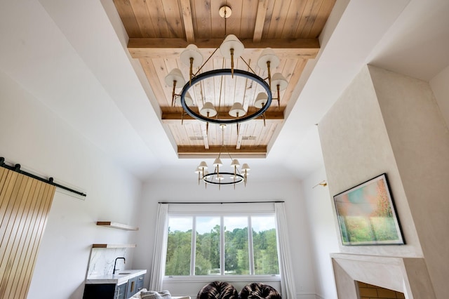 1713 Reflection Ln, Brentwood, TN 37027 - detailed view of a chandelier, a wood ceiling with exposed beams, a tray ceiling, and a barn door