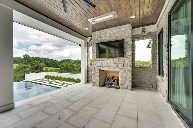 1713 Reflection Ln, Brentwood, TN 37027 - view of patio featuring an outdoor stone fireplace and a hot tub