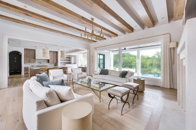 1713 Reflection Ln, Brentwood, TN 37027 - living area featuring beamed ceiling, light wood-type flooring, and a chandelier