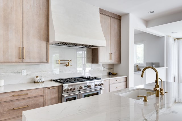 1713 Reflection Ln, Brentwood, TN 37027 - kitchen with double oven range, custom range hood, light stone countertops, tasteful backsplash, and healthy amount of natural light