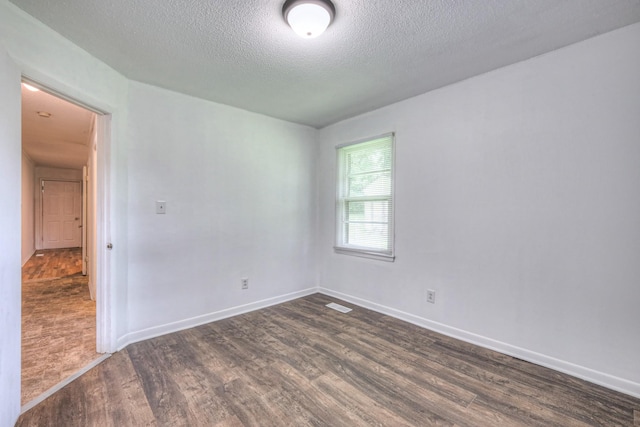 131 Clauson Dr, Columbia, TN 38401 - spare room with dark wood-type flooring and a textured ceiling