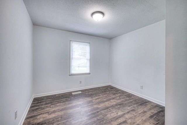 131 Clauson Dr, Columbia, TN 38401 - spare room with a textured ceiling and dark wood-style flooring