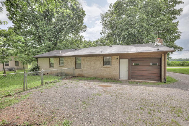 131 Clauson Dr, Columbia, TN 38401 - rear view of property featuring brick siding and a chimney