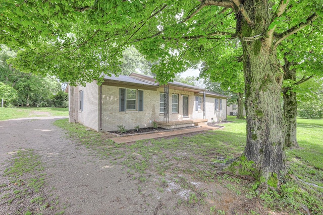 131 Clauson Dr, Columbia, TN 38401 - view of front of property with brick siding and a front lawn
