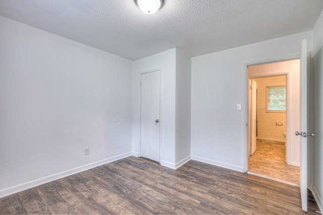 131 Clauson Dr, Columbia, TN 38401 - unfurnished bedroom featuring dark wood finished floors and a textured ceiling