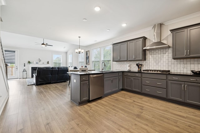 3737 Felipe Way, Murfreesboro, TN 37129 - kitchen featuring appliances with stainless steel finishes, wall chimney range hood, light wood-style floors, open floor plan, and ornamental molding