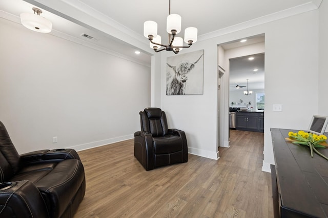 3737 Felipe Way, Murfreesboro, TN 37129 - sitting room with a chandelier, wood finished floors, ornamental molding, and recessed lighting