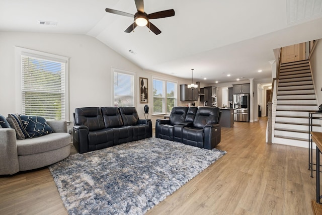 3737 Felipe Way, Murfreesboro, TN 37129 - living room with ceiling fan, vaulted ceiling, stairs, a chandelier, and light wood-type flooring