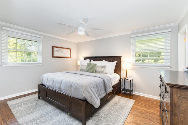 1028 Ridgecrest Dr, Franklin, TN 37069 - bedroom with multiple windows, ornamental molding, light wood finished floors, and ceiling fan