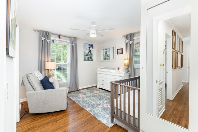 1028 Ridgecrest Dr, Franklin, TN 37069 - bedroom featuring wood finished floors, ceiling fan, and a crib
