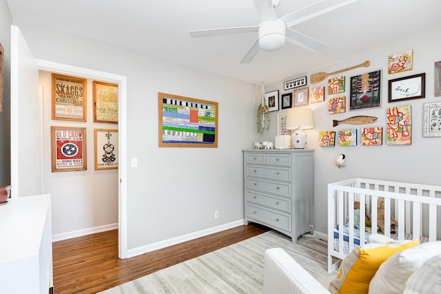 1028 Ridgecrest Dr, Franklin, TN 37069 - bedroom with wood finished floors, a crib, and ceiling fan