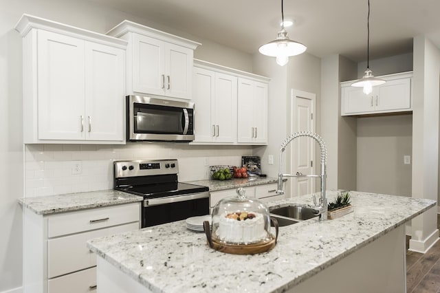 1144 Lock 4 Rd Unit B-4, Gallatin, TN 37066 - kitchen with appliances with stainless steel finishes, decorative backsplash, and white cabinets