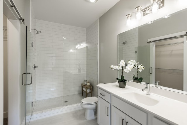 1144 Lock 4 Rd Unit B-4, Gallatin, TN 37066 - full bathroom with a shower stall, a walk in closet, vanity, and tile patterned floors