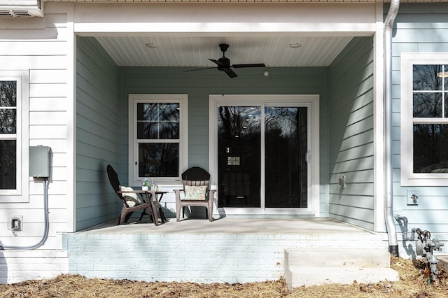 1144 Lock 4 Rd Unit B-4, Gallatin, TN 37066 - view of exterior entry featuring a porch, a ceiling fan, and a wall unit AC