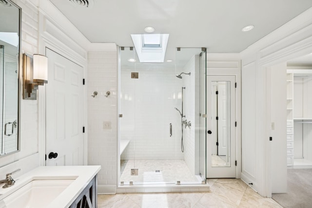 1524 Gordon Petty Dr, Brentwood, TN 37027 - bathroom featuring a stall shower, a skylight, and vanity