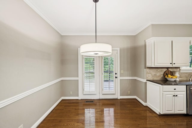 1524 Gordon Petty Dr, Brentwood, TN 37027 - unfurnished dining area featuring dark wood-style floors and crown molding